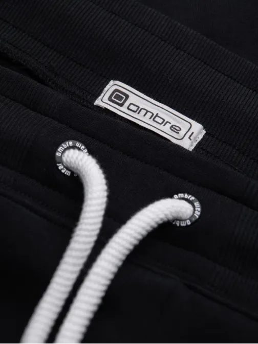 Čierne tepláky s trendy prešívaním V5 PABS-0173