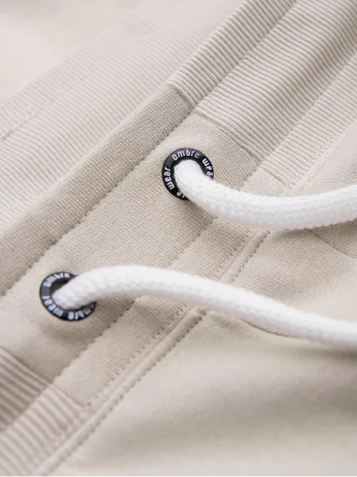 Béžové tepláky s trendy prešívaním V1 PABS-0173