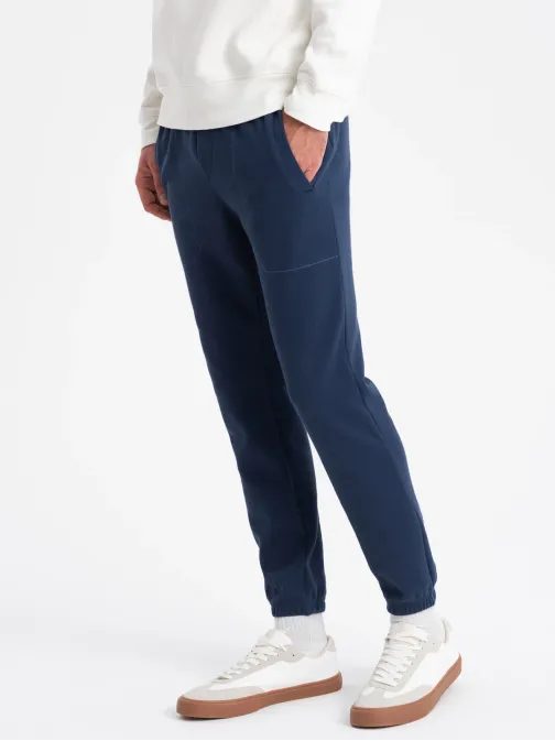 Trendy tmavomodré úpletové tepláky V5 PASK-0143