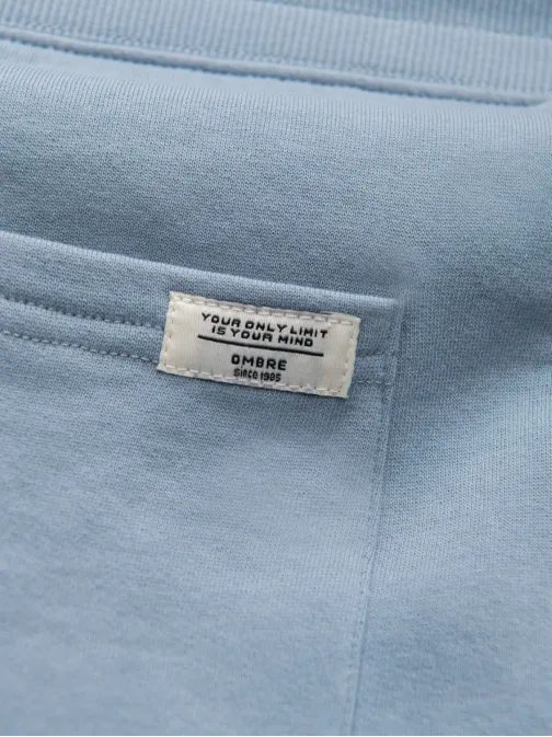 Zaujímavé svetlo modré tepláky V7 PABS-0206