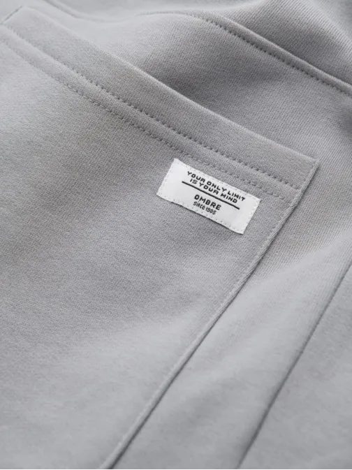 Šedé tepláky s trendy prešívaním V8 PABS-0173