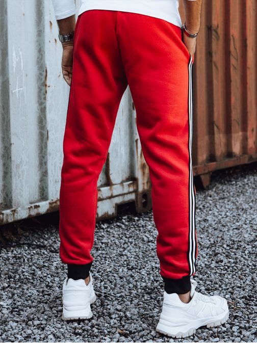 Pánske červené tepláky s ozdobným pásom