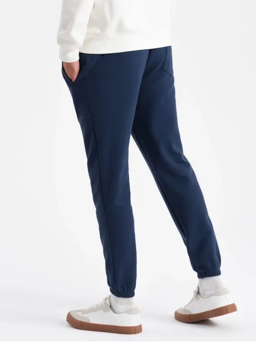 Trendy tmavomodré úpletové tepláky V5 PASK-0143
