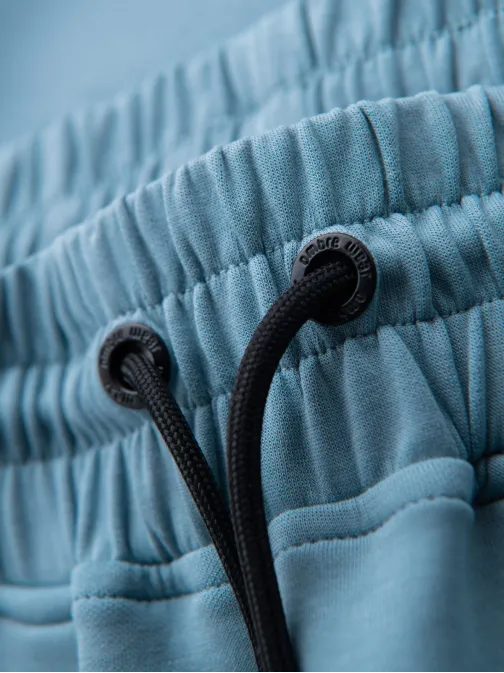 Nadčasové svetlomodré tepláky V4 PASK-0226