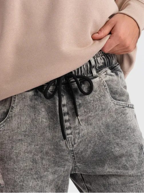 Trendy šedé rifľové joggery s ozdobnými odreninami V3 PADJ-0153
