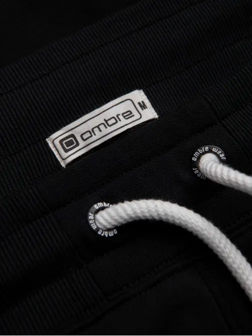 Zaujímavé čierne tepláky V5 PABS-0206