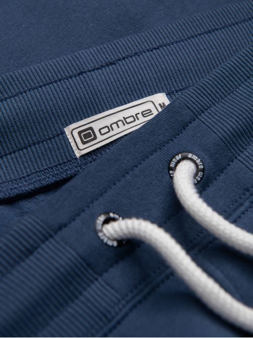 Zaujímavé tmavo modré tepláky V4 PABS-0206