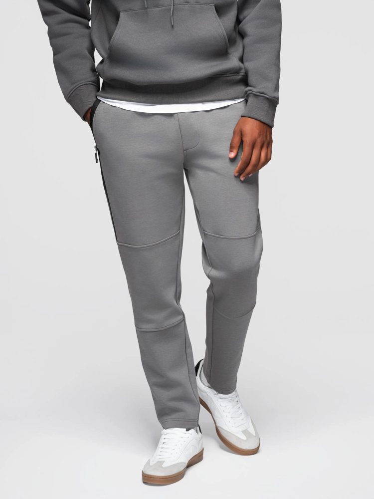 Levně Ombre Clothing Šedé tepláky s prošíváním V3 OM-PASK-0281