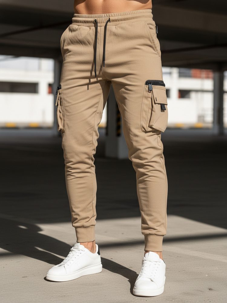 Levně Dstreet Trendy béžové pánské kapsáčové jogger kalhoty UP