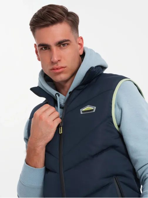 Trendy tmavě modrá prošívaná vesta V3 JAVJ-0210