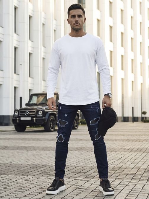 Trendy tmavě modré rifle s módními odřeninami