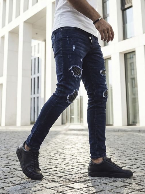 Trendy tmavě modré rifle s módními odřeninami