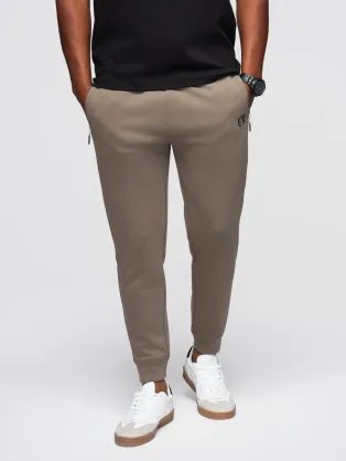 Trendi melegítőnadrág férfiaknak barna V3 OM-PASK-0223