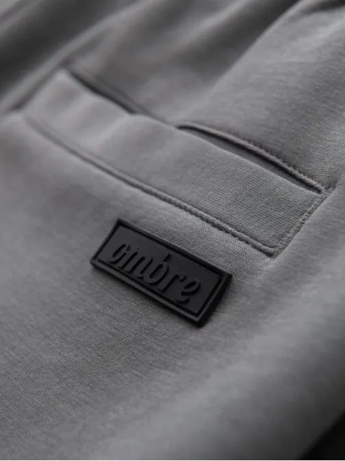 Szürke tréningnadrág steppeléssel V3 OM-PASK-0281