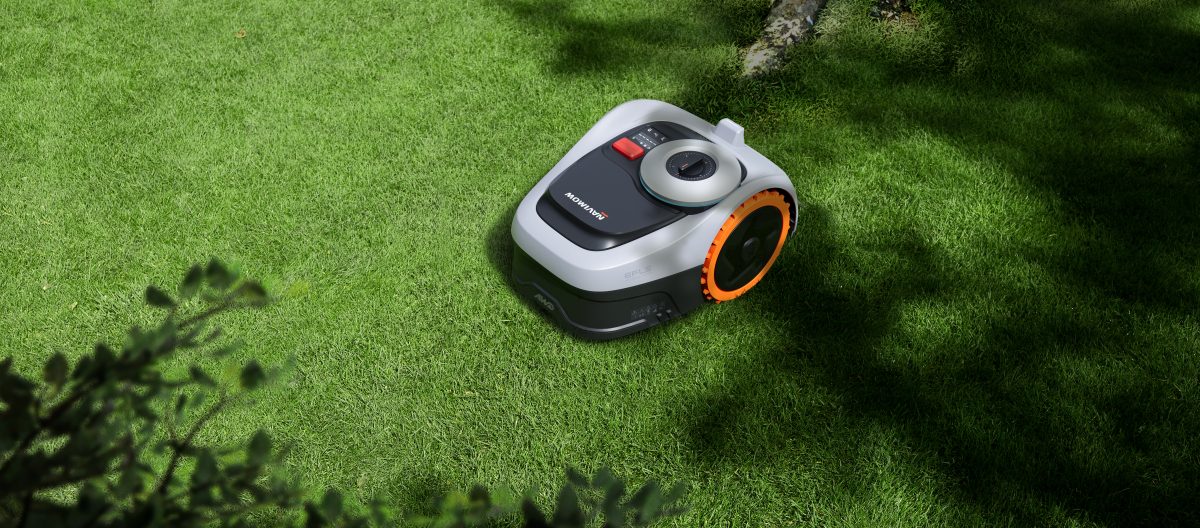 Navimow i205E AWD robotic mower on lawn by house