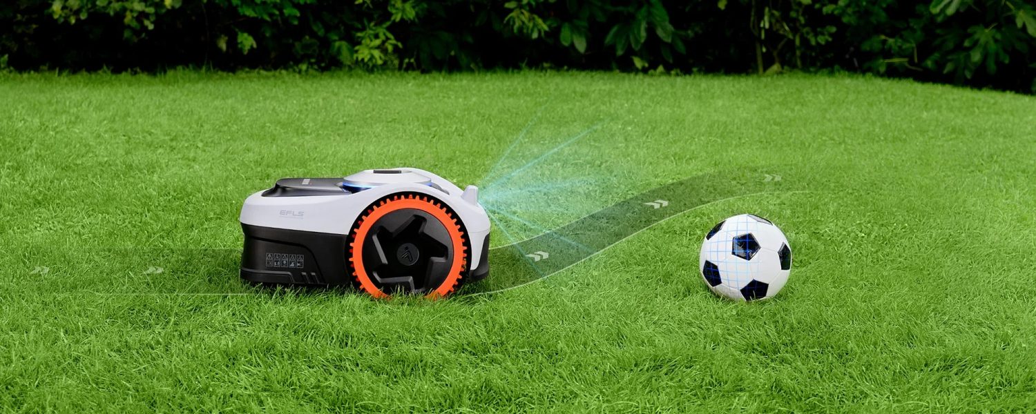 Navimow i205E AWD next to a football