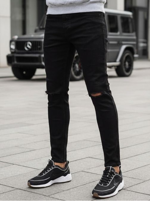 črne trendovske kavbojke z luknjami