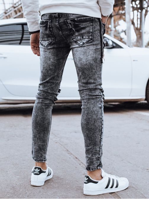 Džins črne raztrgane hlače z okrasno zadrgo