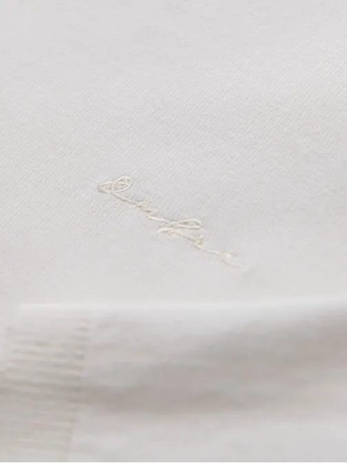 Moška polo majica z dolgimi rokavi in okrasnim našitkom bela v2 om-pols-0140