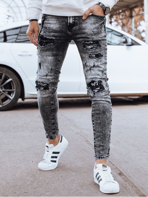 Džins črne raztrgane hlače z okrasno zadrgo