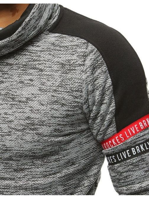 edinstveni siv pulover z našitki