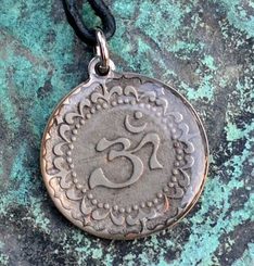 OM - tibetský znak, amulet