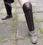 HEAVY LEATHER GREAVES REINFORCED WITH STEEL STRIPS, PRICE FOR THE PAIR - LEATHER ARMOUR/GLOVES