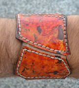 HELIOS, HANDCRAFTED LEATHER WRISTBAND - WRISTBANDS