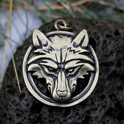 WOLF - wolf's head in a circle, amulet zinc old brass