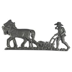 Ploughman and horses, stable decoration, cast iron