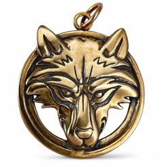 Wolf's head in a ring, bronze pendant