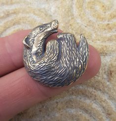 BADGER, pendant, zinc