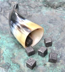 SIX FORGED DICE and a horn cup