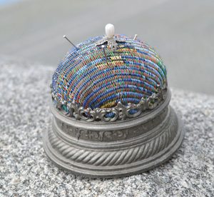LARGE HISTORICAL PINCUSHION, tin