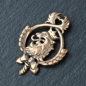 Czech lion in lime branch, pendant, bronze