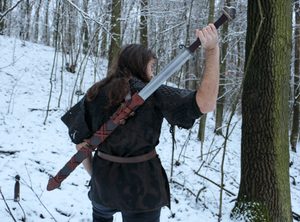 BARBARIAN two-handed sharp fantasy sword with Scabbard on the back