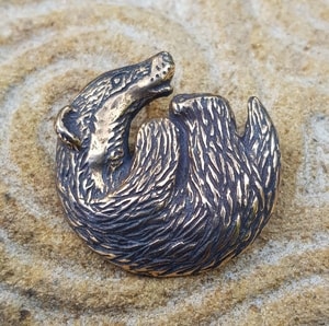 BADGER, pendant, bronze