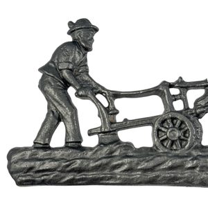 Ploughman and horses, barn decoration, cast iron