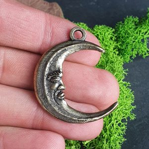 MOON with face, amulet, zinc, old brass