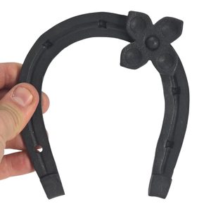 Forged horseshoe with four-leaf clover