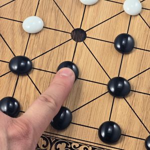 Alquerque, the medieval game of kings - game board and playing stones