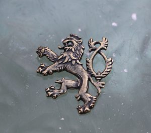 HERALDIC TWO-TAILED LION, pendant, brass plated
