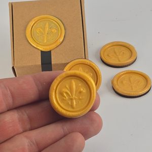 Lily token, a sign of nobility and faith