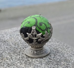 HISTORICAL PINCUSHION, tin