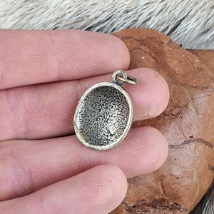 WOLF TRACK, pendant, zinc, ant. brass