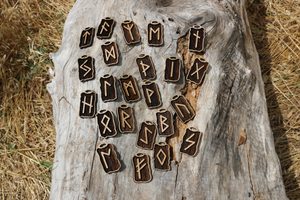 WOODEN RUNES SET - FUTHARK, 24 pieces of pendants and pouch