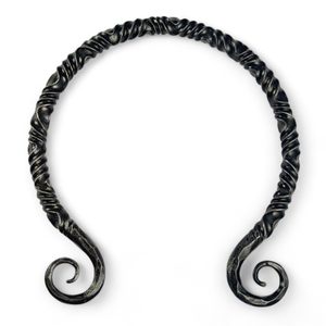 TWISTING IRON TORC