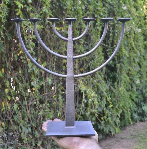 MENORAH, FORGED SEVEN-BRANCHED CANDLESTICK