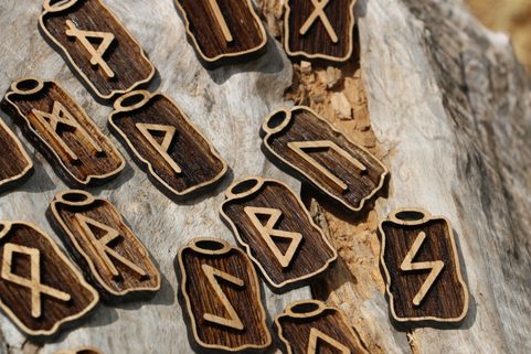 WOODEN RUNES SET - FUTHARK, 24 PIECES OF PENDANTS AND POUCH