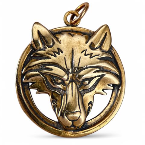 WOLF'S HEAD IN A RING, BRONZE PENDANT
